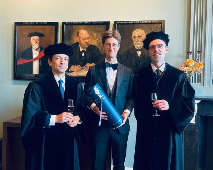 Lukawski with his supervisors.