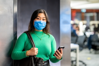 Student poses for a photo wearing a face mask because of the coronavirus crisis