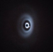 The newborn planet WISPIT 2b is eating its way through its dusty “cradle” as it orbits its parent star. This image, taken with ESO's Very Large Telescope, is the first clear image of a baby planet in a multi-ringed disc.