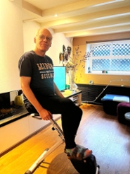 After breakfast, Jasper does his exercises on the exercise bike at home